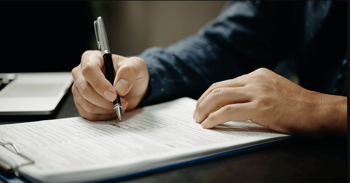 Signing a form - Artisan Piano Tuning and Restoration