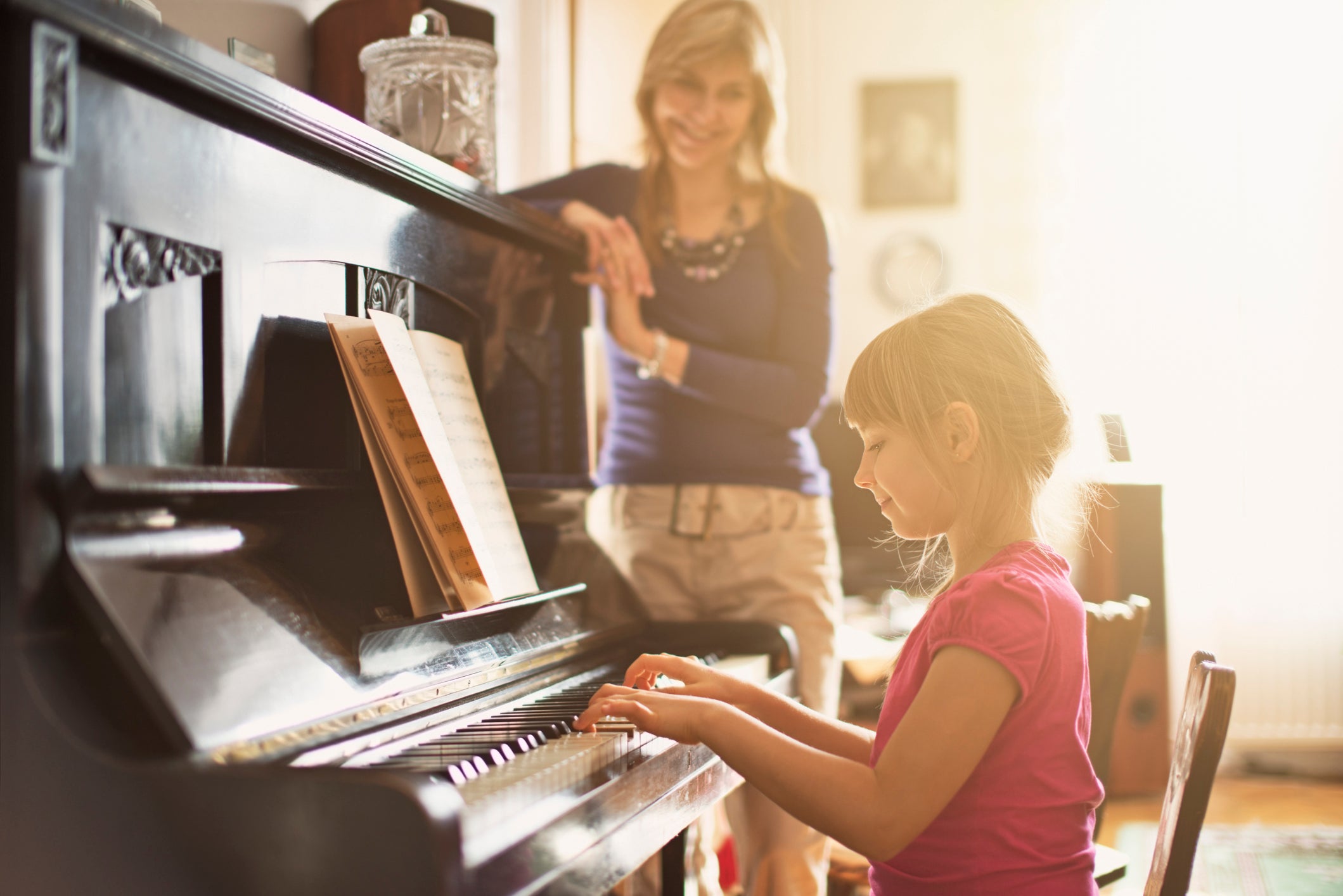 Girl playing piano - Artisan Piano Tuning and Restoration